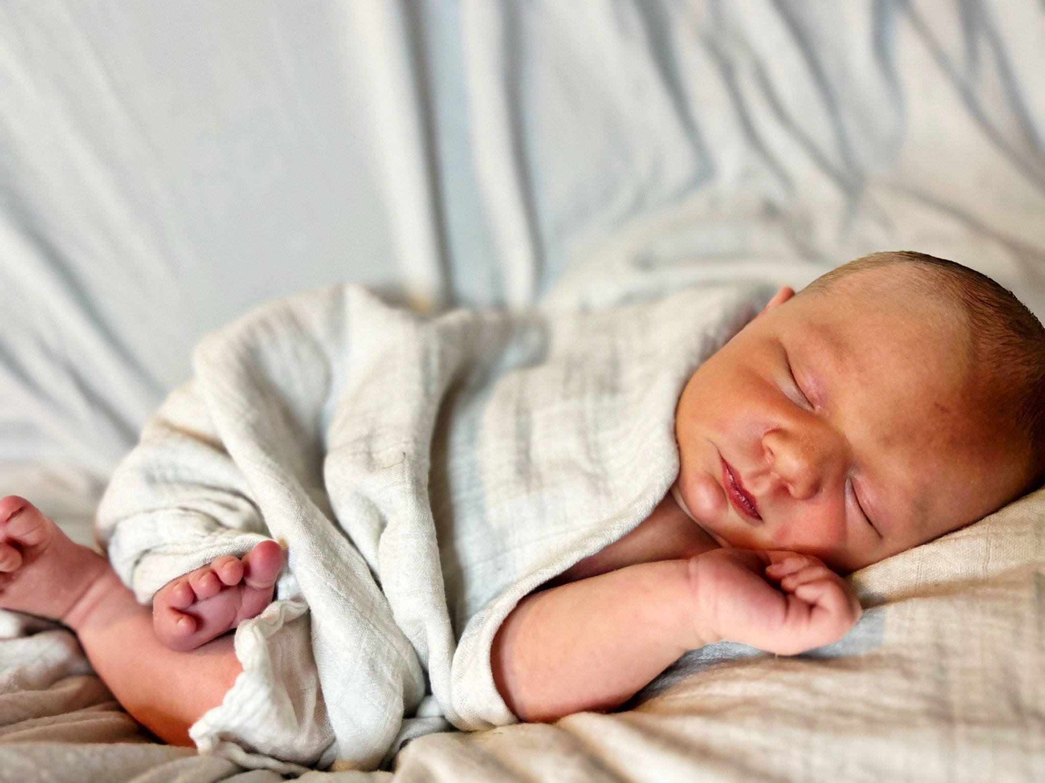 Kashton is registered to the contest to win money with this photo: baby, baby_sleeping, baby_toddler_clothing, barefoot, bedding, bedtime, cheek, child, comfort, event, face, gesture, human_body, linens, person, portrait_photography, room, skin, sleep, sleeve