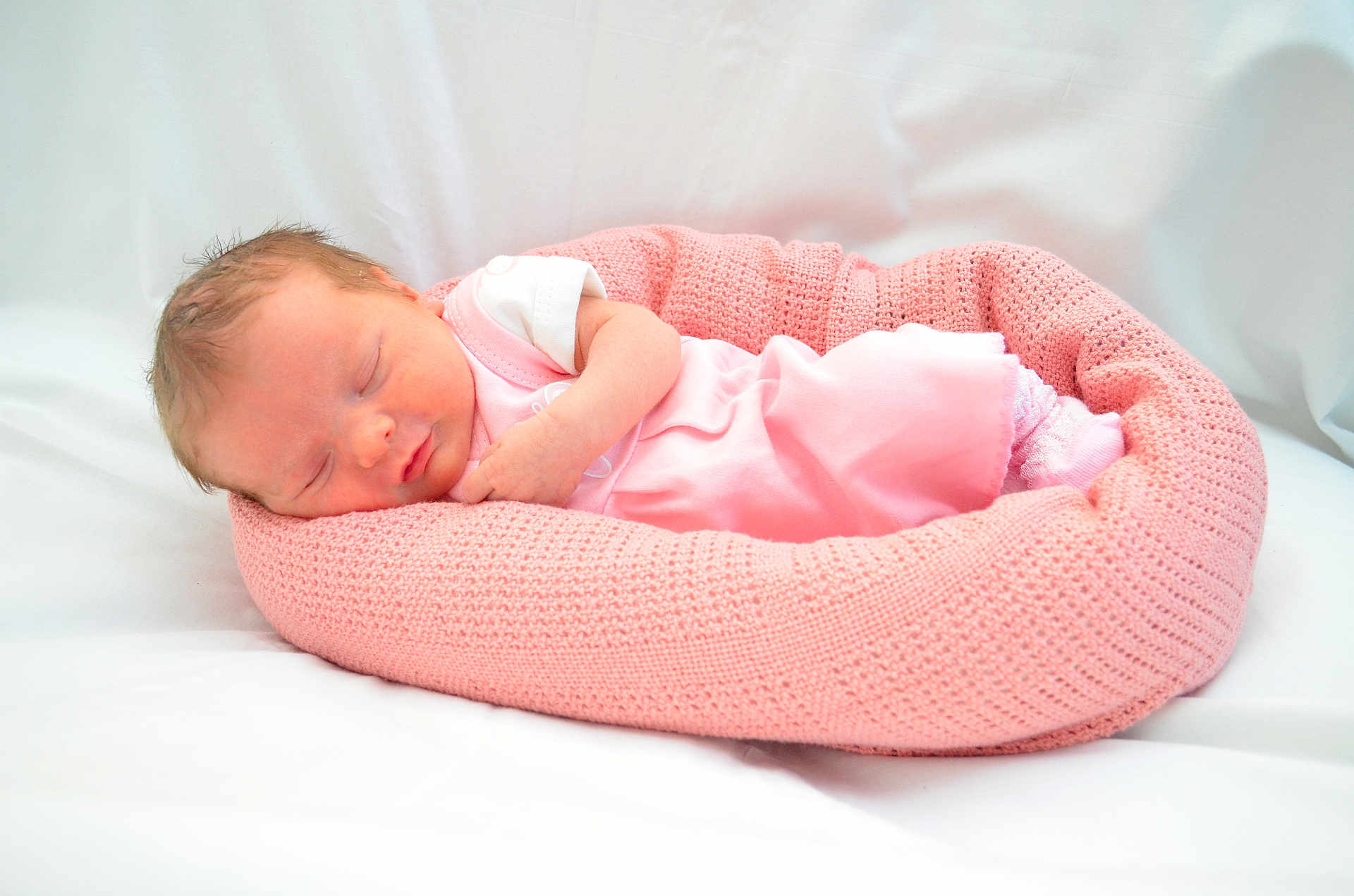 Lily joined the competition — help win amazing prizes! newborn, baby, sleeping, pink, knitted, blanket, infant, soft, cozy, cute, child, portrait, peaceful, resting, toddler, clothing, sock, head, face, bed