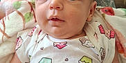 Aurora joined the competition — help win amazing prizes! arm, baby, blanket, bottle, couch, cozy, cupcake_pattern, cute, expression, eyes, face, hand, indoor, infant, lap, onesie, person, relaxation, table, tattoo