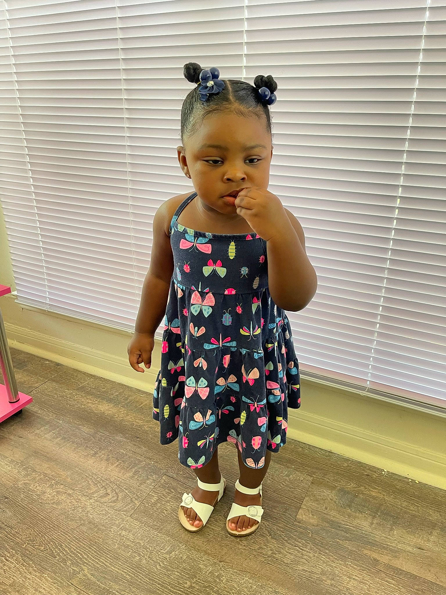 Klover is registered to the contest to win money with this photo: arm, baby, baby_toddler_clothing, day_dress, dress, flooring, fun, happy, human_body, human_leg, joint, neck, pattern, person, shoulder, sitting, sleeve, t_shirt, toddler, waist