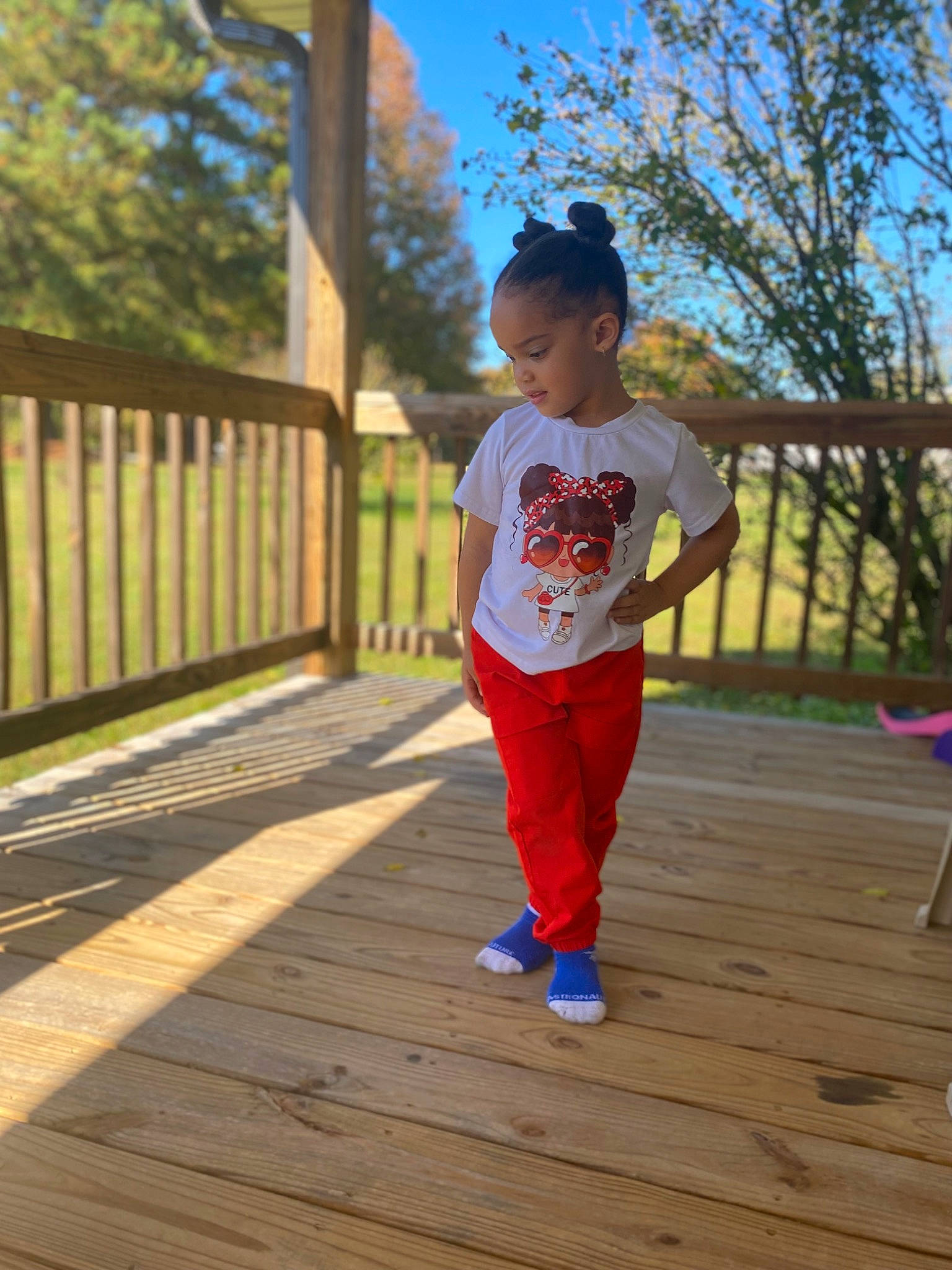 Xiomara joined the competition — help win amazing prizes! child, city, deck, electric_blue, fence, flooring, fun, grass, happy, hardwood, hat, leisure, person, plant, play, recreation, sky, t_shirt, toddler, tree