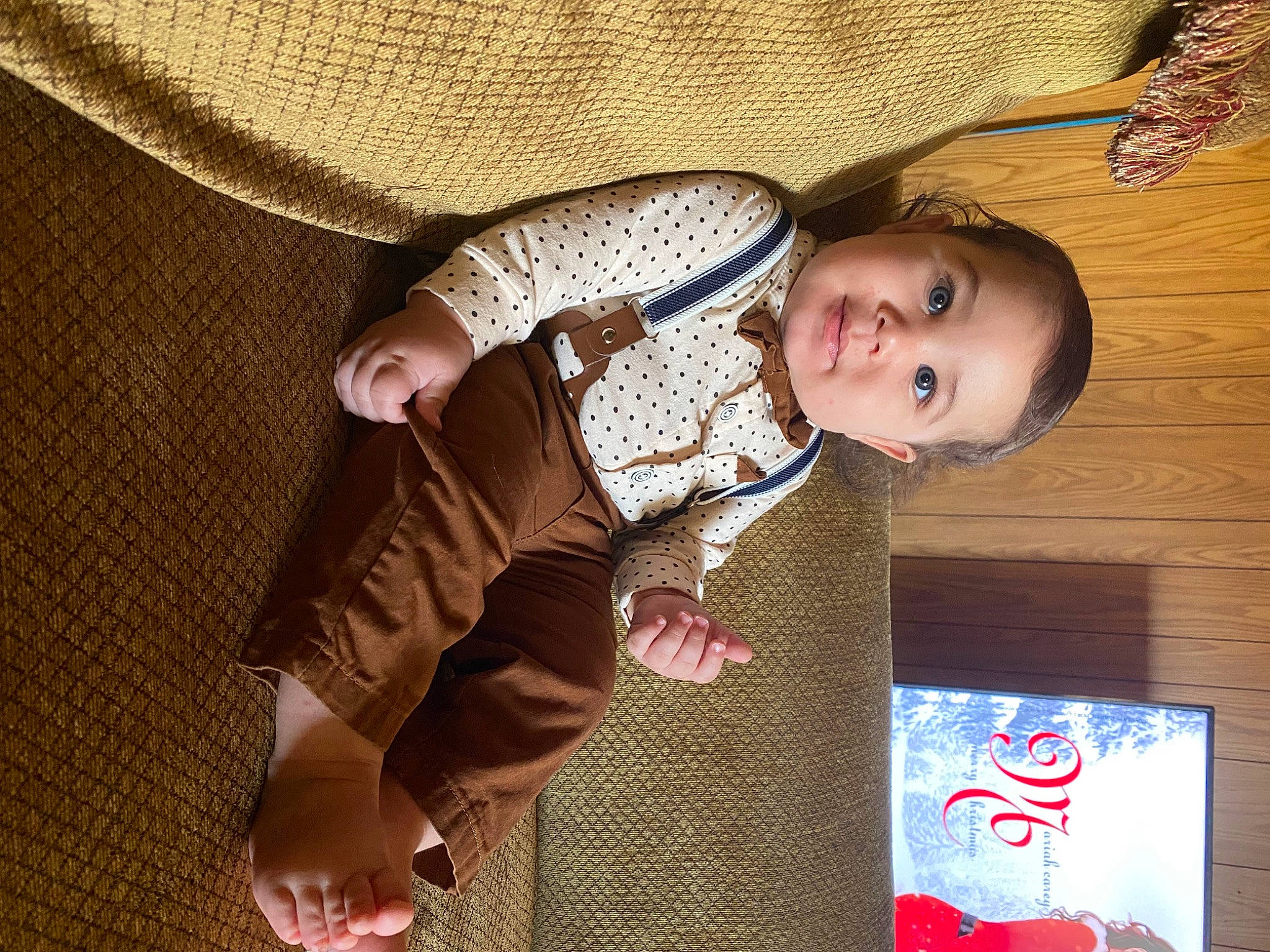 Levi is registered to the contest to win money with this photo: baby, baby_products, baby_toddler_clothing, cheek, child, comfort, facial_expression, flooring, fun, happy, human_body, pattern, people, person, sitting, skin, sleeve, smile, textile, toddler