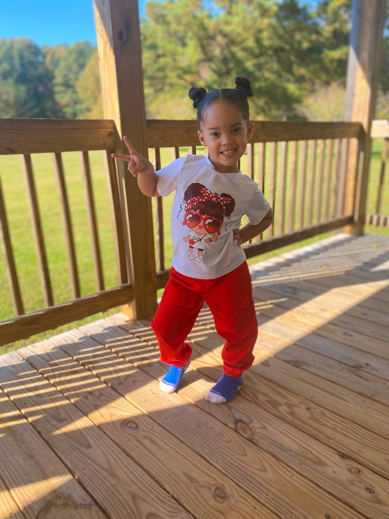 Xiomara joined the competition — help win amazing prizes! baby, baby_toddler_clothing, electric_blue, face, flooring, fun, happy, hardwood, joy, leisure, people_in_nature, person, plank, sky, sleeve, smile, t_shirt, toddler, tree, waist