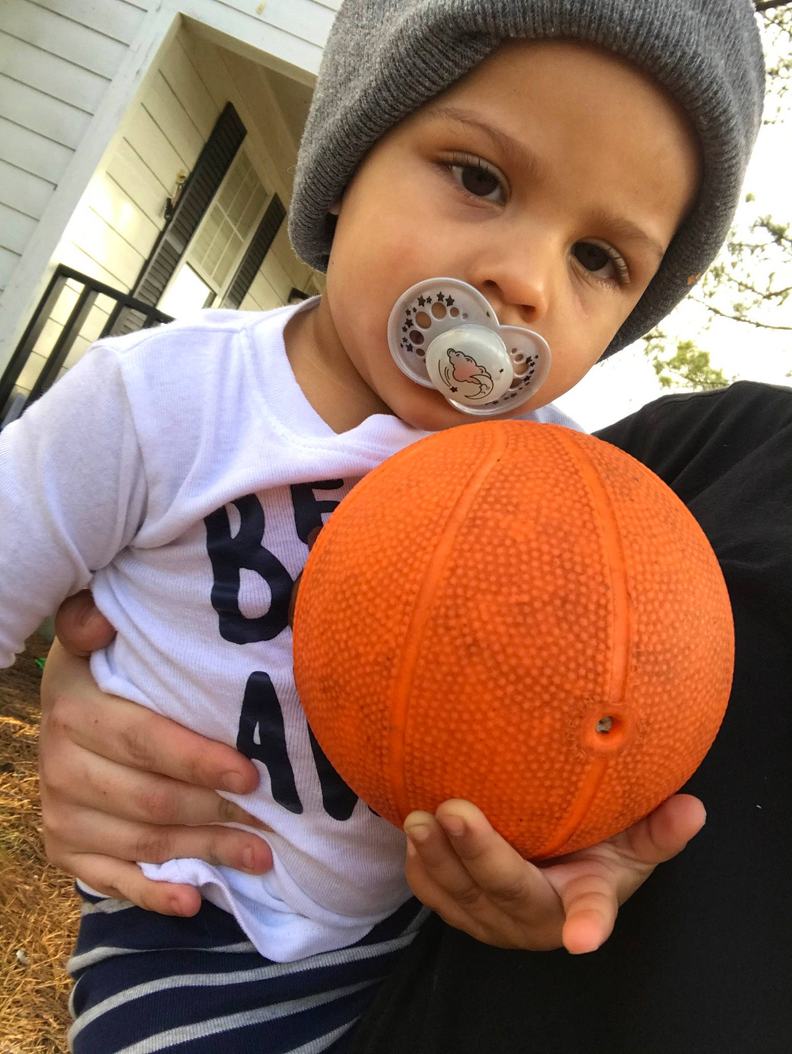 Fred is registered to the contest to win money with this photo: baby, ball, calabaza, child, fruit, hat, headgear, orange, person, plant, pumpkin, toddler