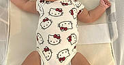Jadeyn joined the competition — help win amazing prizes! baby, child, comfort, cushion, cute, fabric, hello_kitty, indoors, infant, mesh, onesie, peaceful, portrait, relaxation, resting, sleeping, small, sock, soft, white