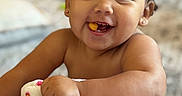Jadeyn joined the competition — help win amazing prizes! baby, child, smile, face, blanket, arm, indoor, happy, cute, skin, person, toddler, food, cheeky, expression, playful, soft, colorful, cozy, nibble
