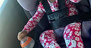 Bradlee is registered to the contest to win money with this photo: child, toddler, baby, car_seat, car, harness, safety_belt, smiling, laughing, open_mouth, reaching, hand, bottle, floral_clothing, hello_kitty, pink, outdoor_light, vehicle_interior, portrait, happy