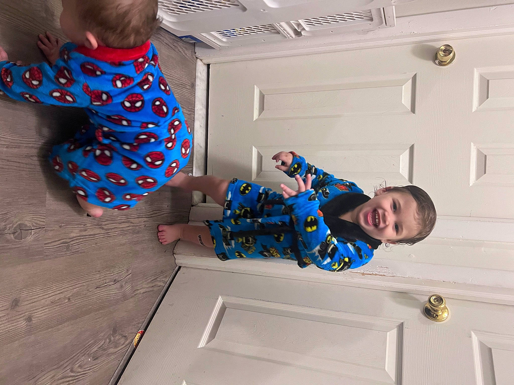 Vidal is registered to the contest to win money with this photo: baby_toddler_clothing, child, comfort, elbow, electric_blue, flooring, fun, joy, pattern, person, room, sitting, sleeve, smile, t_shirt, toddler, wood