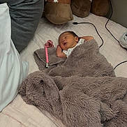 Valentina is registered to the contest to win money with this photo: baby, newborn, infant, sleeping, blanket, plush_giraffe, stuffed_animal, bed, pacifier_clip, plush_blanket, pillow, bedding, cozy, soft_texture, cord, pink_accessory, asleep, tiny_hand, nursery, cute