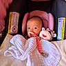 baby, infant, car_seat, blanket, pacifier, plush_toy, cow_toy, pink, white_blanket, clip, child, seat, indoors, cute, soft_toy, newborn, face, comfort, rest, small