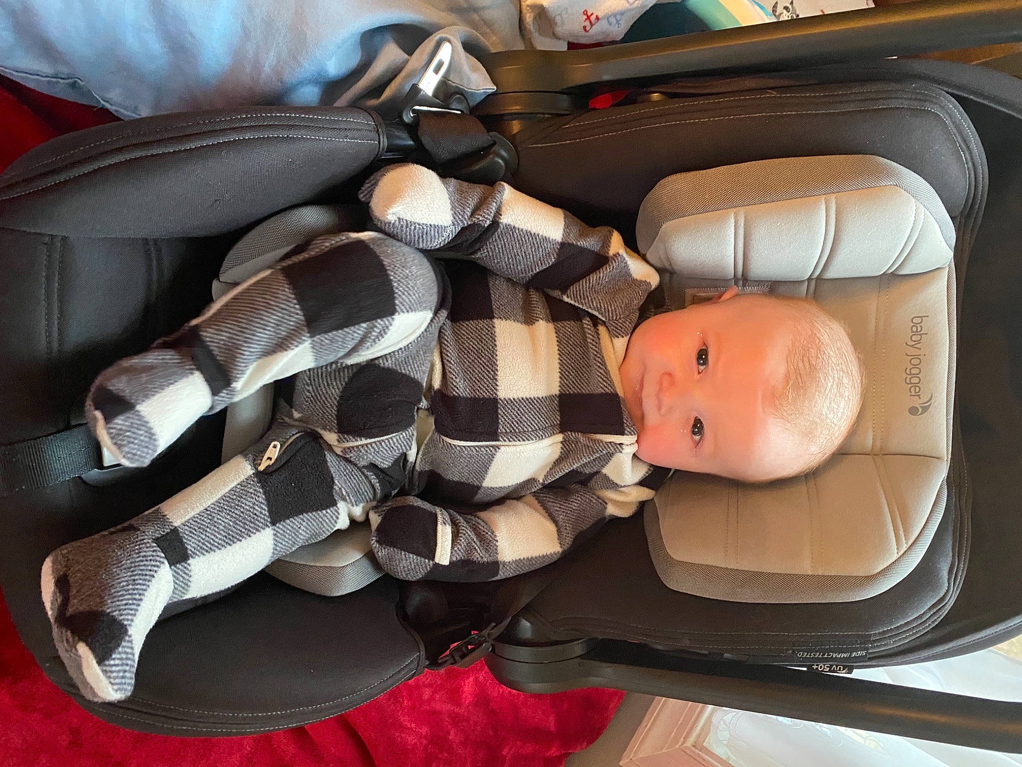 Casey is registered to the contest to win money with this photo: auto_part, automotive_design, automotive_lighting, baby_products, bag, car_seat, car_seat_cover, carmine, comfort, eyewear, fashion_accessory, headgear, motor_vehicle, person, personal_luxury_car, personal_protective_equipment, plaid, sandal, toy, trunk