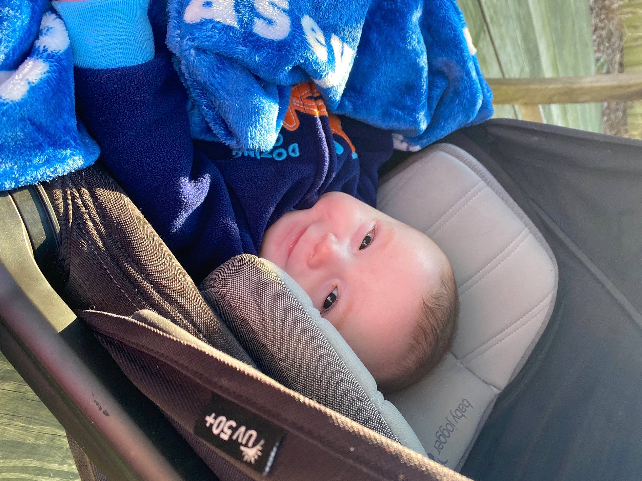 Casey is registered to the contest to win money with this photo: baby, baby_carriage, baby_products, baby_toddler_clothing, blue, car_seat, child, comfort, electric_blue, fun, nail, nap, person, plant, sitting, sleep, toddler, tree