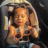 Fasha Douglas joined the competition — help win amazing prizes! toddler, child, car_seat, sunglasses, sunlight, seatbelt, baby, cute, hands, face, hair, indoors, car_interior, black_hair, summer, expression, sitting, safety, straps, clothing
