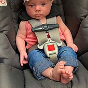 Tessa is registered to the contest to win money with this photo: baby, barefoot, blue_jeans, bow, car_seat, chicco, child, clothing, cute, floor_tiles, foot, headband, indoor, infant, looking_at_camera, pink_top, safety_harness, seated, strap, young_child