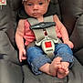 baby, barefoot, blue_jeans, bow, car_seat, chicco, child, clothing, cute, floor_tiles, foot, headband, indoor, infant, looking_at_camera, pink_top, safety_harness, seated, strap, young_child