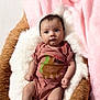 baby, infant, onesie, pink, blanket, soft, fur, bed, cozy, cute, child, portrait, sleeping_area, newborn, clothing, indoor, person, relaxing, young, expression