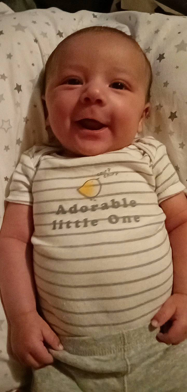 Leonidas joined the competition — help win amazing prizes! baby, baby_toddler_clothing, cheek, chin, eyebrow, facial_expression, happy, iris, lip, mouth, neck, nose, person, pink, product, skin, sleeve, smile, t_shirt, toddler