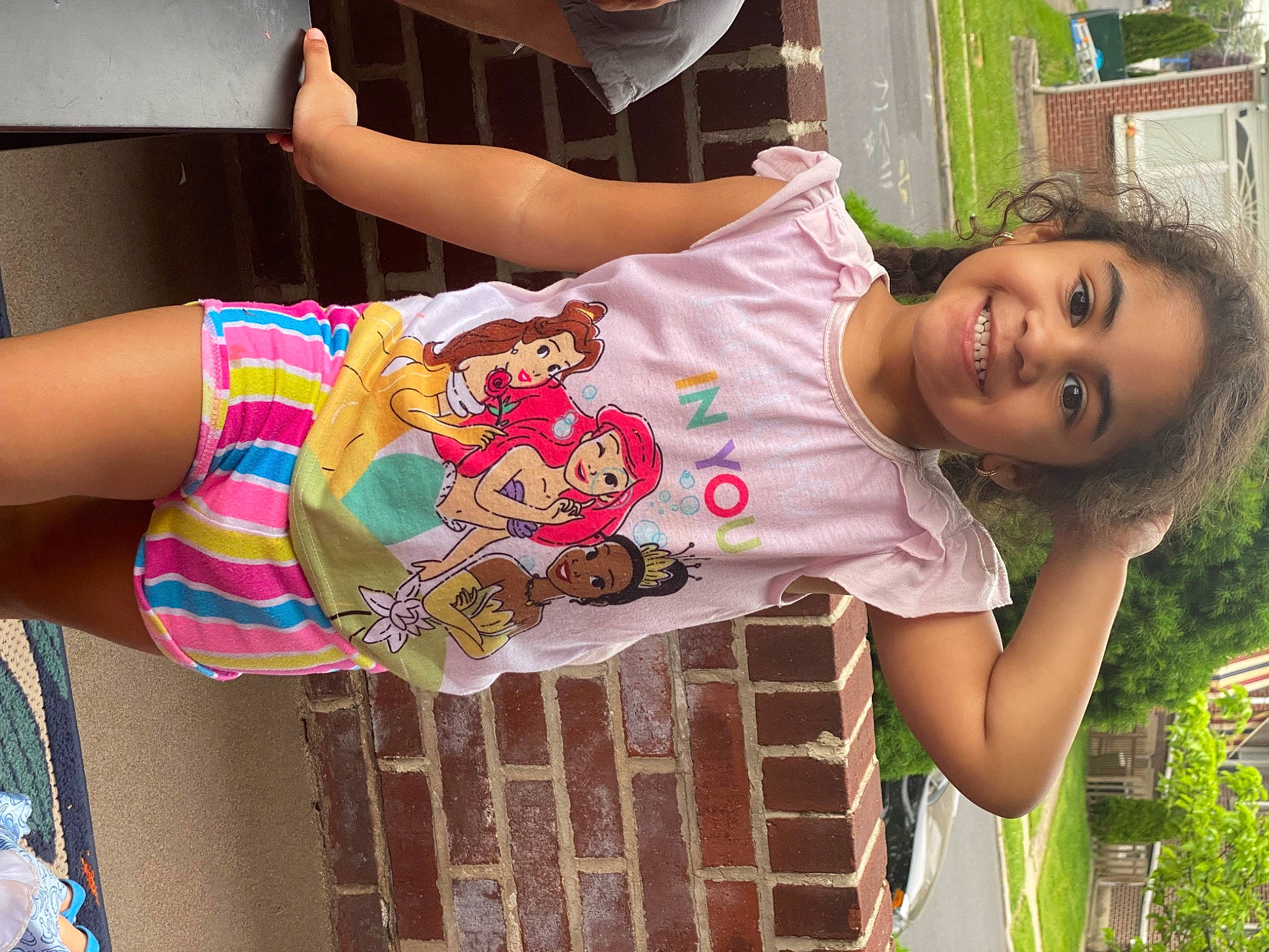 Naelisha is registered to the contest to win money with this photo: child, dress, fashion_design, fun, grass, happy, human, human_leg, joy, leg, leisure, pattern, person, pink, plant, play, sleeve, smile, textile, thigh