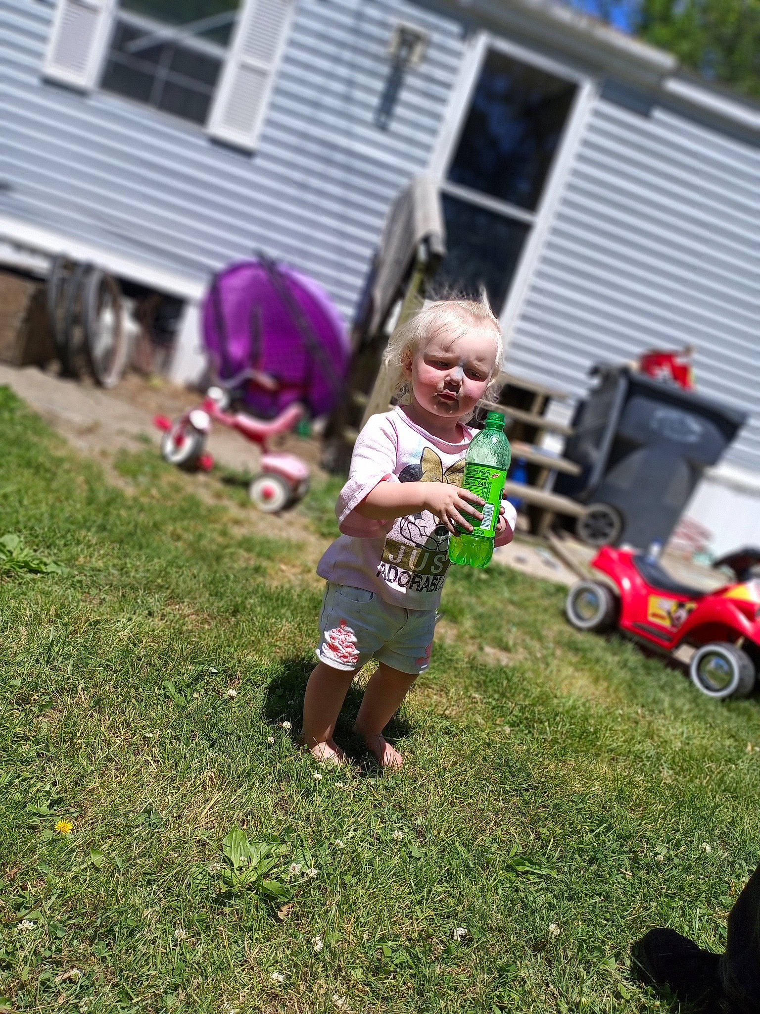 Paisleigh joined the competition — help win amazing prizes! backyard, car, child, city_car, fun, garden, grass, home, house, landscaping, lawn, person, plant, play, toddler, tree, vehicle, yard
