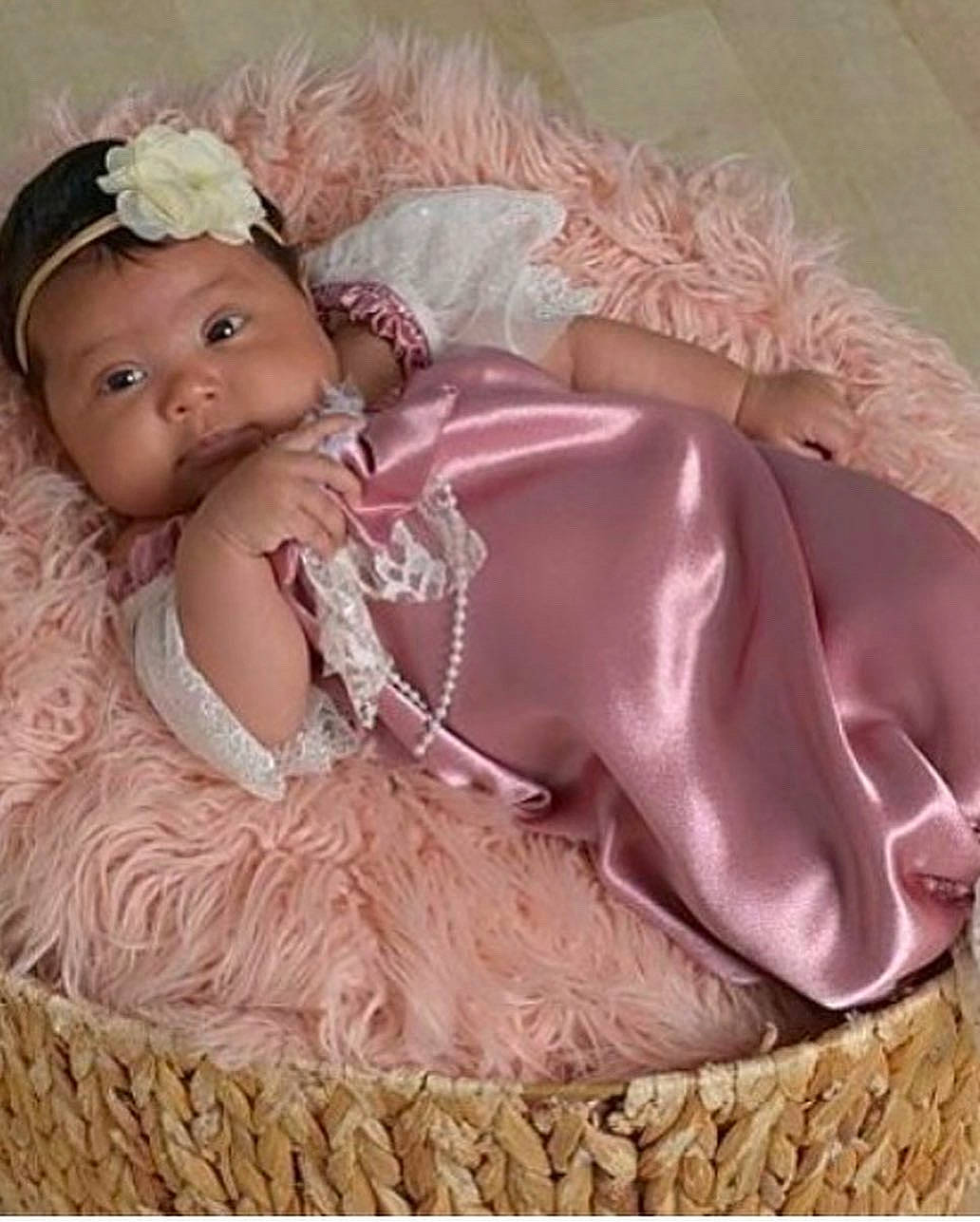 Alani is registered to the contest to win money with this photo: baby, baby_toddler_clothing, bridal_accessory, doll, dress, embellishment, eyelash, fashion_accessory, flower, hair_accessory, headband, headpiece, jewellery, magenta, peach, person, pink, ruffle, toddler, toy