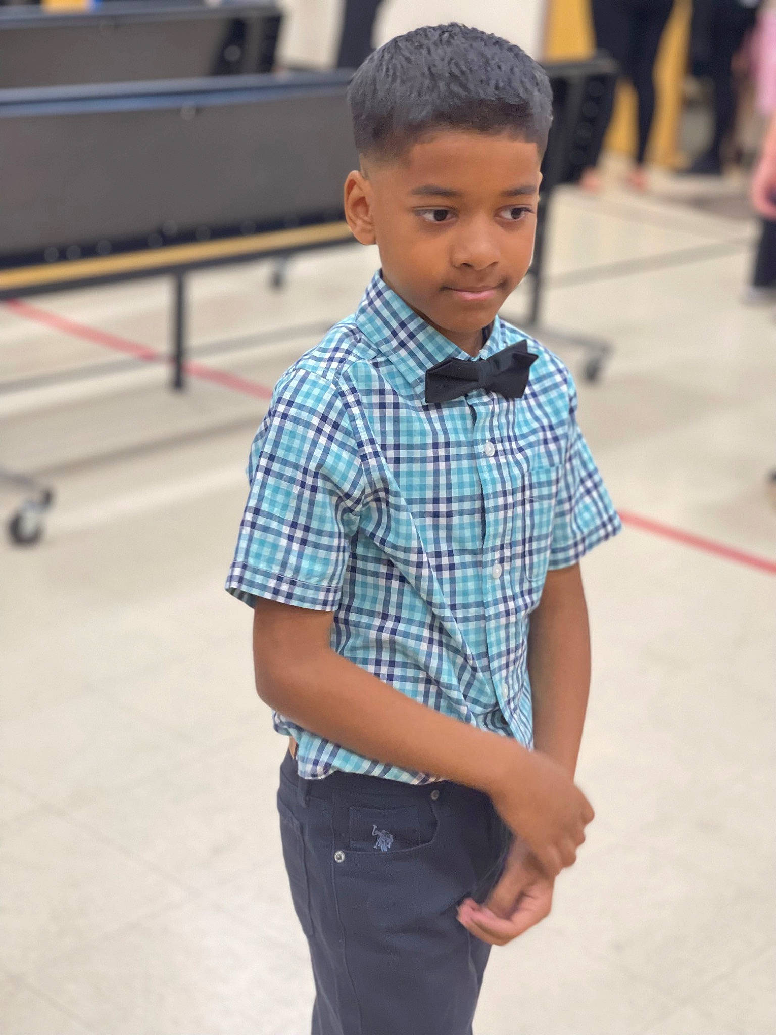 Naquan is registered to the contest to win money with this photo: child, collar, denim, dress_shirt, electric_blue, face, fashion_design, flooring, fun, head, joint, pattern, people, person, plaid, shoulder, sleeve, t_shirt, tartan, toddler