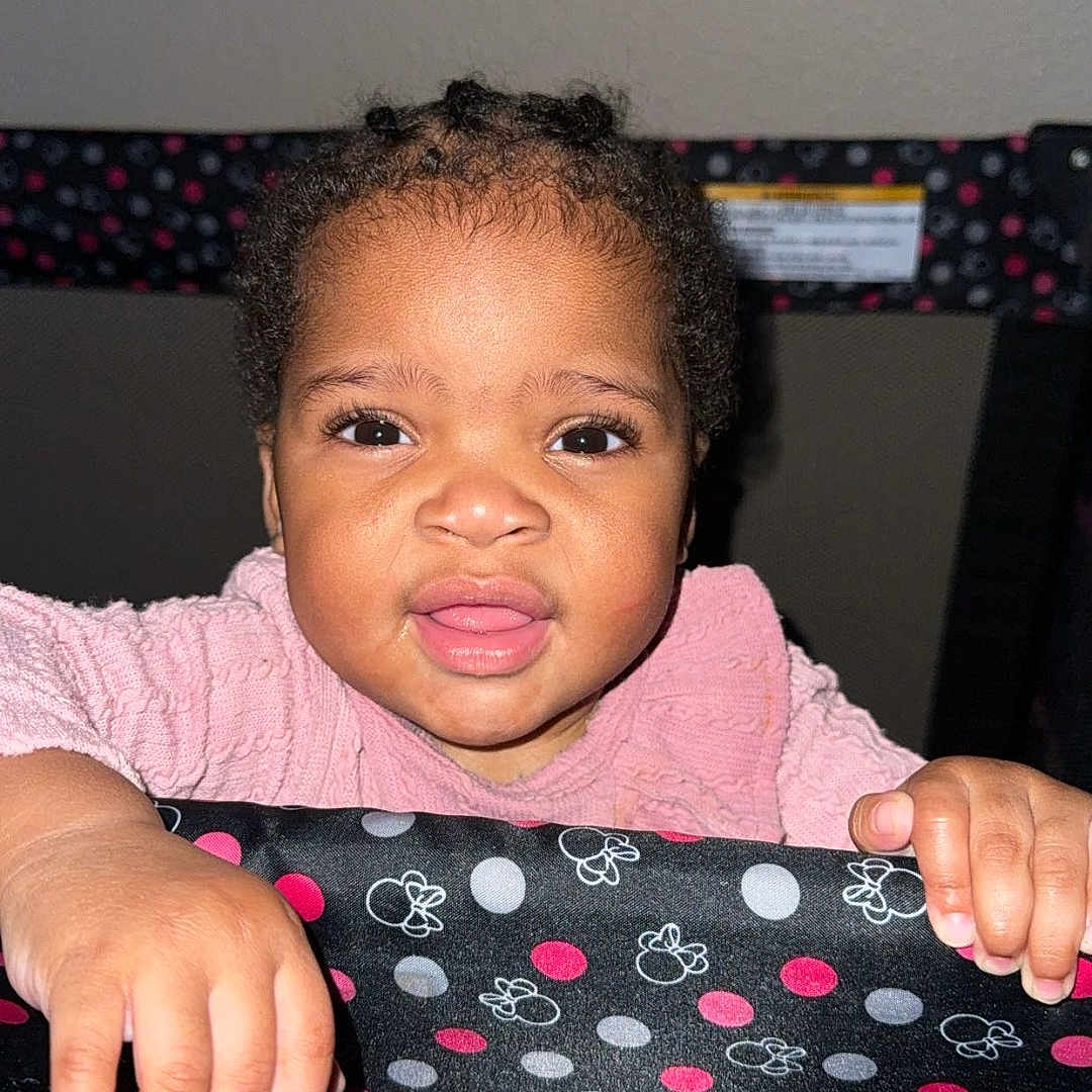 Da Laia joined the competition — help win amazing prizes! baby, child, closeup, curly_hair, cuteness, expression, face, grip, hands, indoor, infant, looking_at_camera, person, pink_clothing, playpen, polka_dots, portrait, skin, smiling, young_child