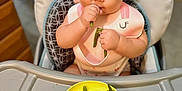 Rei joined the competition — help win amazing prizes! baby, bib, child, curious, cute, eating, feeding, food, green_beans, hair_clips, hand, high_chair, indoor, infant, kitchen, person, pigtails, portrait, table, yellow_bowl