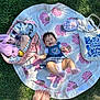 Rei joined the competition — help win amazing prizes! baby, infant, blanket, pink, elephant_pattern, plush_toy, bunny, bag, clothing, doll, tote_bag, grass, outdoor, feet, happy, smiling, child, sunlight, playtime, casual