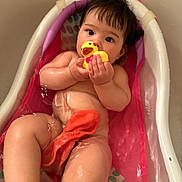 Rei is registered to the contest to win money with this photo: baby, bathtub, water, rubber_duck, child, skin, bath_time, toddler, toy, naked, cute, indoors, infant, pink, colorful, relaxing, sitting, small_bathtub, playful, wet