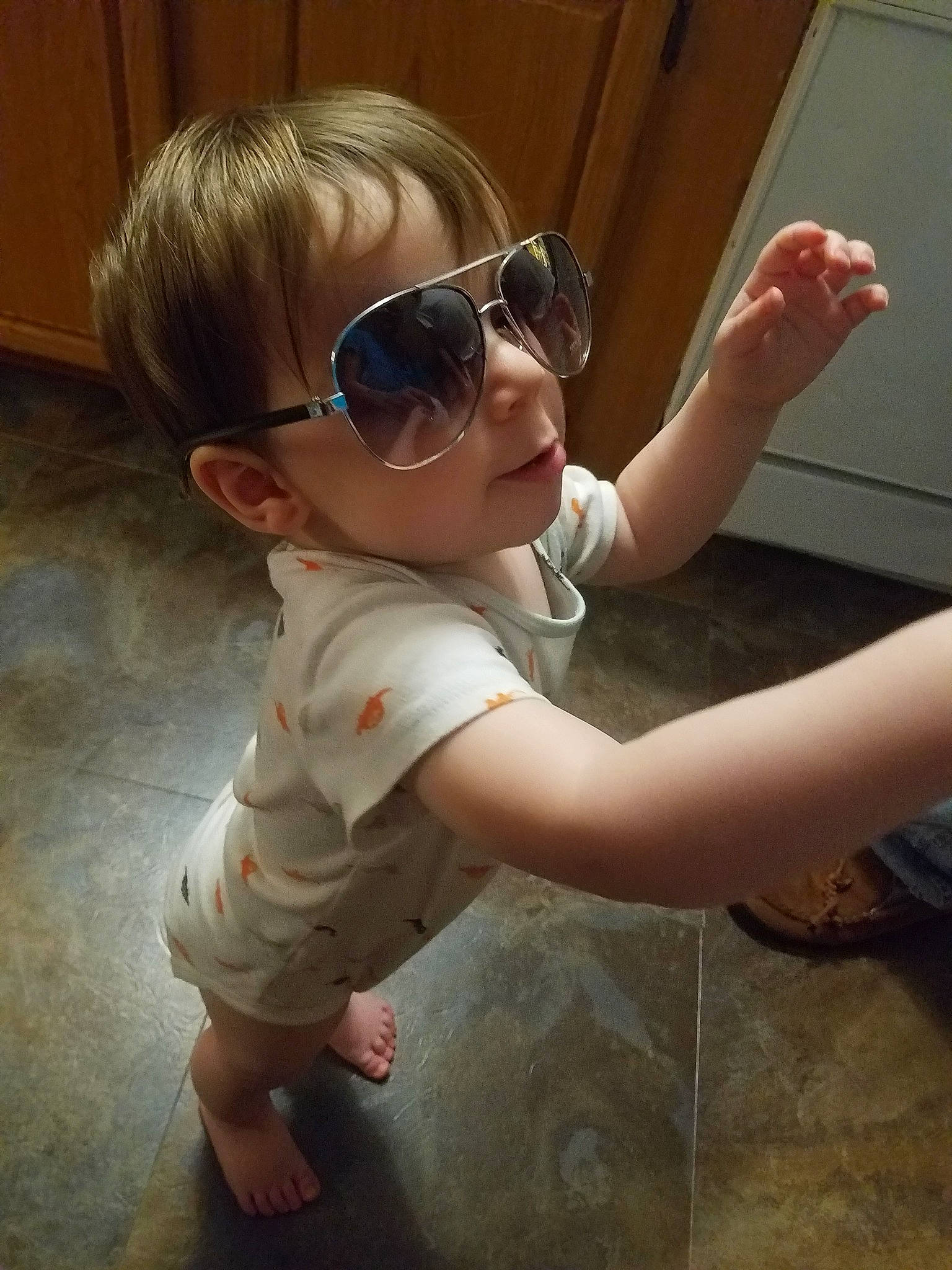 Kayden joined the competition — help win amazing prizes! arm, baby, cheek, child, cool, ear, eyewear, floor, fun, glasses, leg, muscle, person, personal_protective_equipment, skin, sunglasses, toddler, vision_care