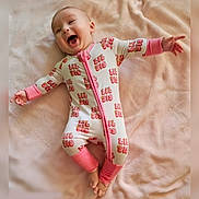 Gwen joined the competition — help win amazing prizes! arms_outstretched, baby, blanket, cozy, cute_pose, feet, graphic_print, infant, laughing, lying_down, newborn, nursery, onesie, pink, portrait, printed_text, smiling, soft_texture, toes, zipper