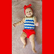 Gwen joined the competition — help win amazing prizes! baby, child, smiling, headband, red_bow, striped_clothing, lying_down, blanket, infant, cute, happy, playful, person, skin, legs, arms, indoors, portrait, toddler, fashion
