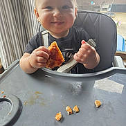 Gwen joined the competition — help win amazing prizes! baby, child, clothing, crumbs, curtains, eating, face, food, hand, happy, high_chair, indoor, light, person, pizza, seat, smile, table, tray, window