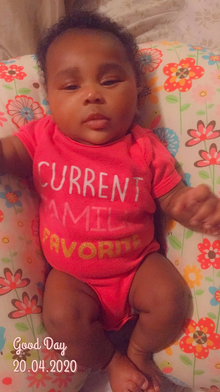 Macy is registered to the contest to win money with this photo: baby, baby_toddler_clothing, cheek, child, lip, mouth, person, pink, skin, smile, thumb, toddler