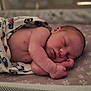 Noah is registered to the contest to win money with this photo: newborn, baby, sleeping, blanket, footprints, star_pattern, crib, infant, peaceful, soft_lighting, skin, face, arm, hand, bed, rest, child, portrait, cute, indoors