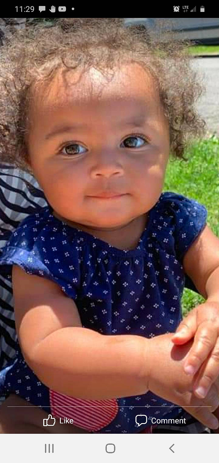 Alanna is registered to the contest to win money with this photo: arm, azure, baby_toddler_clothing, cheek, chin, eye, eyelash, face, finger, gesture, hairstyle, happy, iris, lip, mouth, neck, nose, person, skin, sleeve