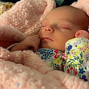 Paisley is registered to the contest to win money with this photo: baby, bedding, blanket, closed_eyes, cozy, face, floral_pajamas, hand, infant, newborn, nursery, peaceful, pink_blanket, portrait, relaxation, skin, sleeping, soft_texture, swaddle, tiny_fingers