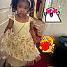 carpet, cartoon, child, curly_hair, cute, door, dress, floor, floral, footwear, girl, headband, heart, home, indoor, jewelry, person, rainbow, stickers, wall