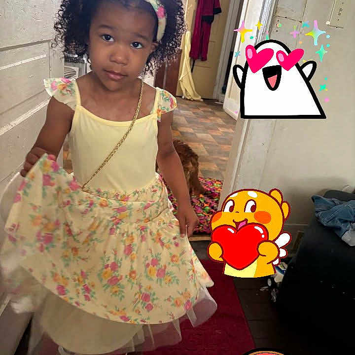 Ma'Kyia is registered to the contest to win money with this photo: carpet, cartoon, child, curly_hair, cute, door, dress, floor, floral, footwear, girl, headband, heart, home, indoor, jewelry, person, rainbow, stickers, wall