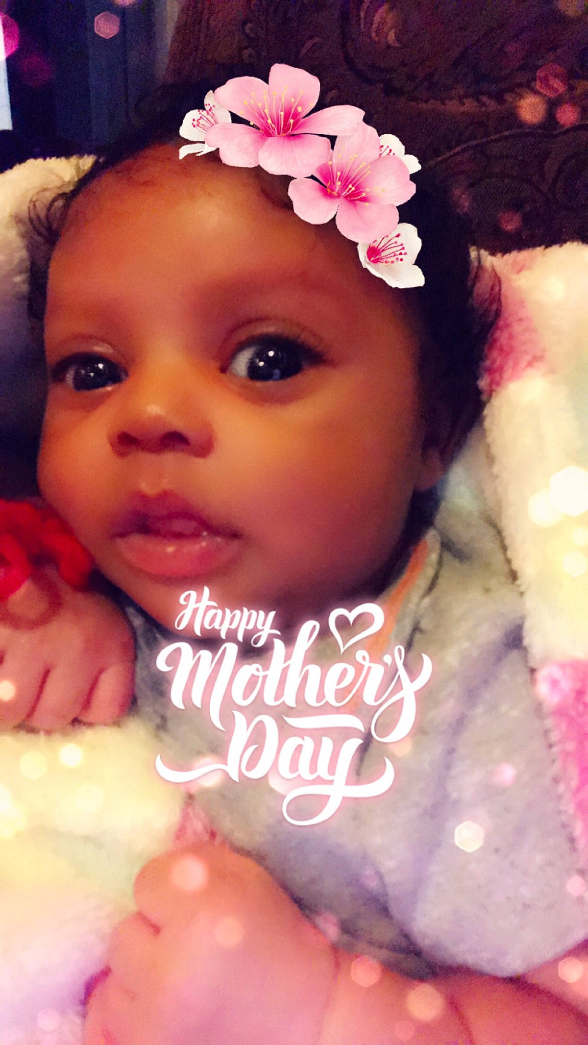 Emiliana is registered to the contest to win money with this photo: baby, beauty, cheek, child, eye, eyebrow, face, forehead, hair_accessory, head, headband, headgear, headpiece, lip, nose, person, petal, photography, pink, skin