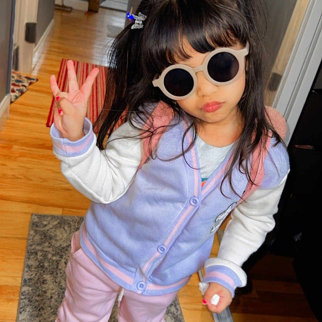 Jazmyn is registered to the contest to win money with this photo: accessories, child, clothing, coat, costume, face, female, footwear, girl, glasses, hardwood, head, jacket, pants, person, photography, portrait, shoe, sunglasses, wood
