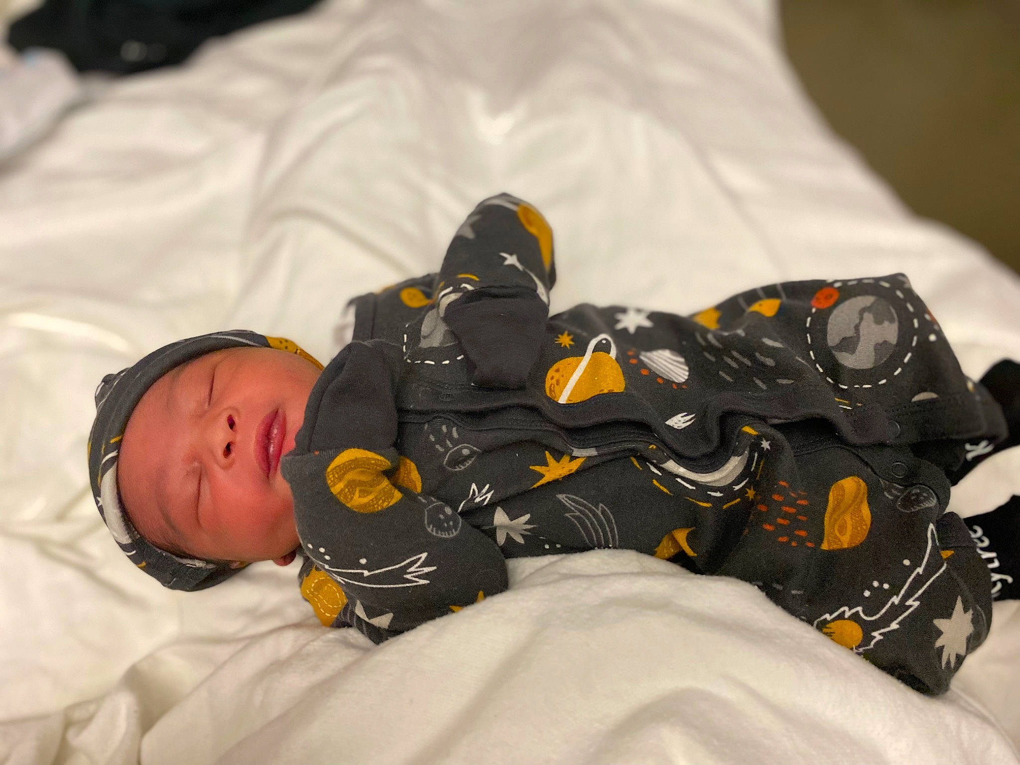 Kyiree is registered to the contest to win money with this photo: athletic_shoe, baby, baby_sleeping, baby_toddler_clothing, bedtime, carmine, comfort, outdoor_shoe, pattern, person, personal_protective_equipment, room, sleeve, sportswear, toddler, walking_shoe