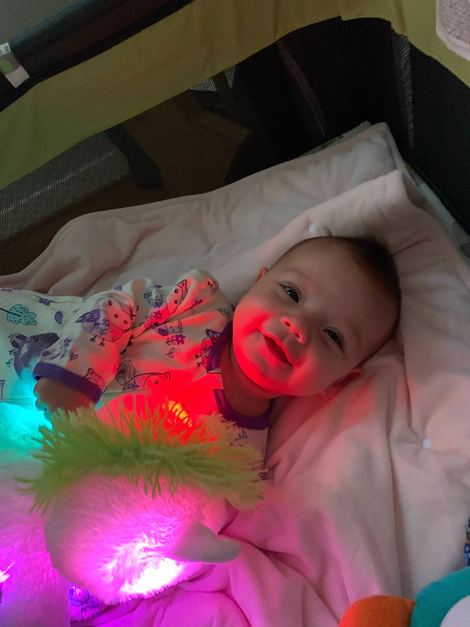 Harlowe is registered to the contest to win money with this photo: baby, baby_products, baby_toddler_clothing, bed, bedding, bedtime, child, comfort, event, eye, fun, happy, head, linens, magenta, person, pink, room, smile, textile