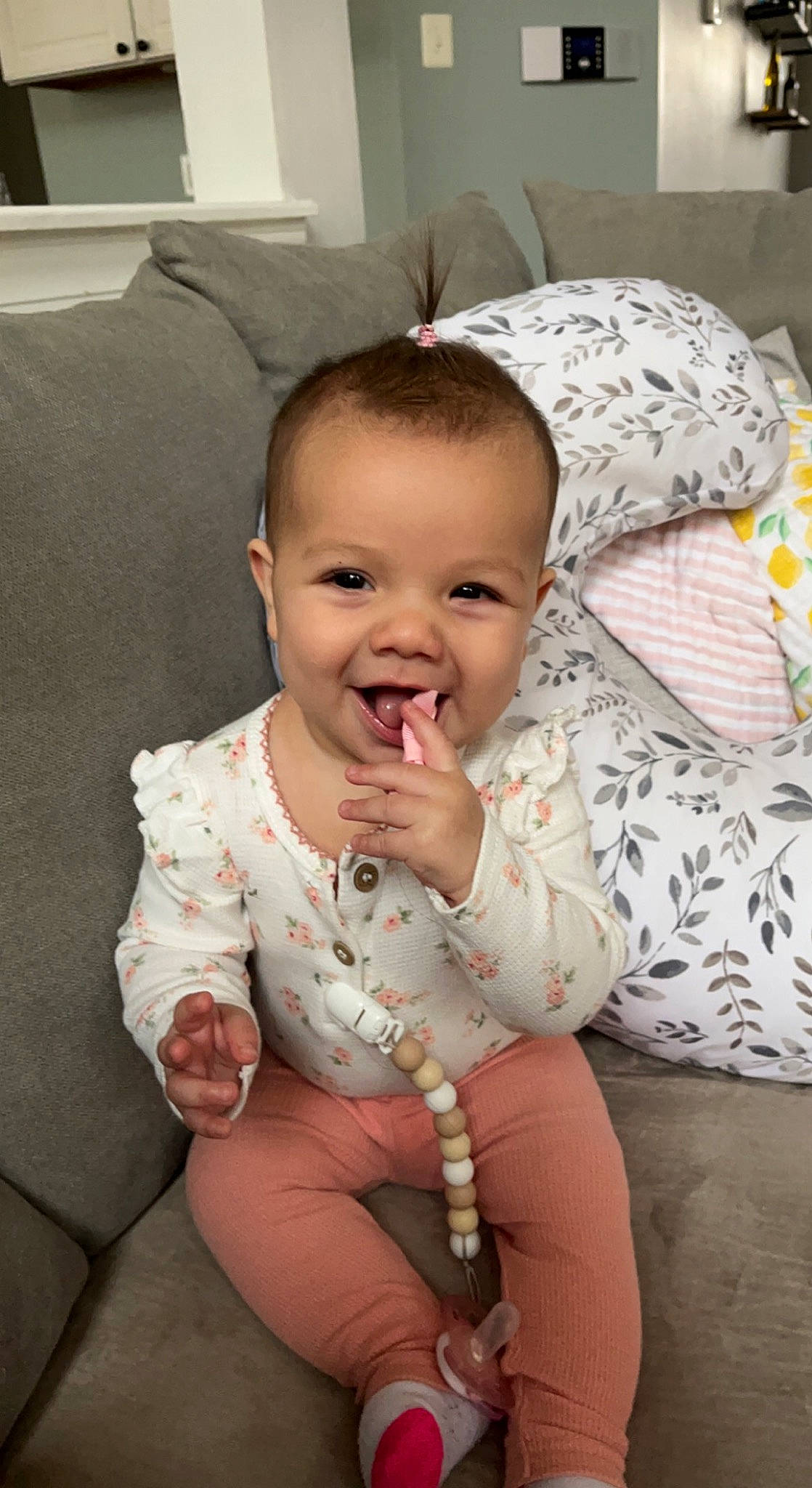 Harlowe is registered to the contest to win money with this photo: baby, baby_toddler_clothing, cheek, comfort, couch, dress, eye, flash_photography, gesture, hand, happy, iris, joy, lip, mammal, mouth, person, skin, sleeve, smile