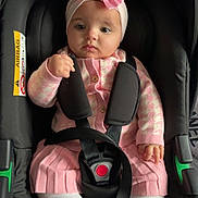 Aaliyah-Mai joined the competition — help win amazing prizes! baby, child, car_seat, pink_bow, headband, pink_clothing, white_tights, safety_strap, infant, cute, indoor, seatbelt, serious_expression, toddler, portrait, baby_girl, sitting, closeup, child_seat, baby_fashion