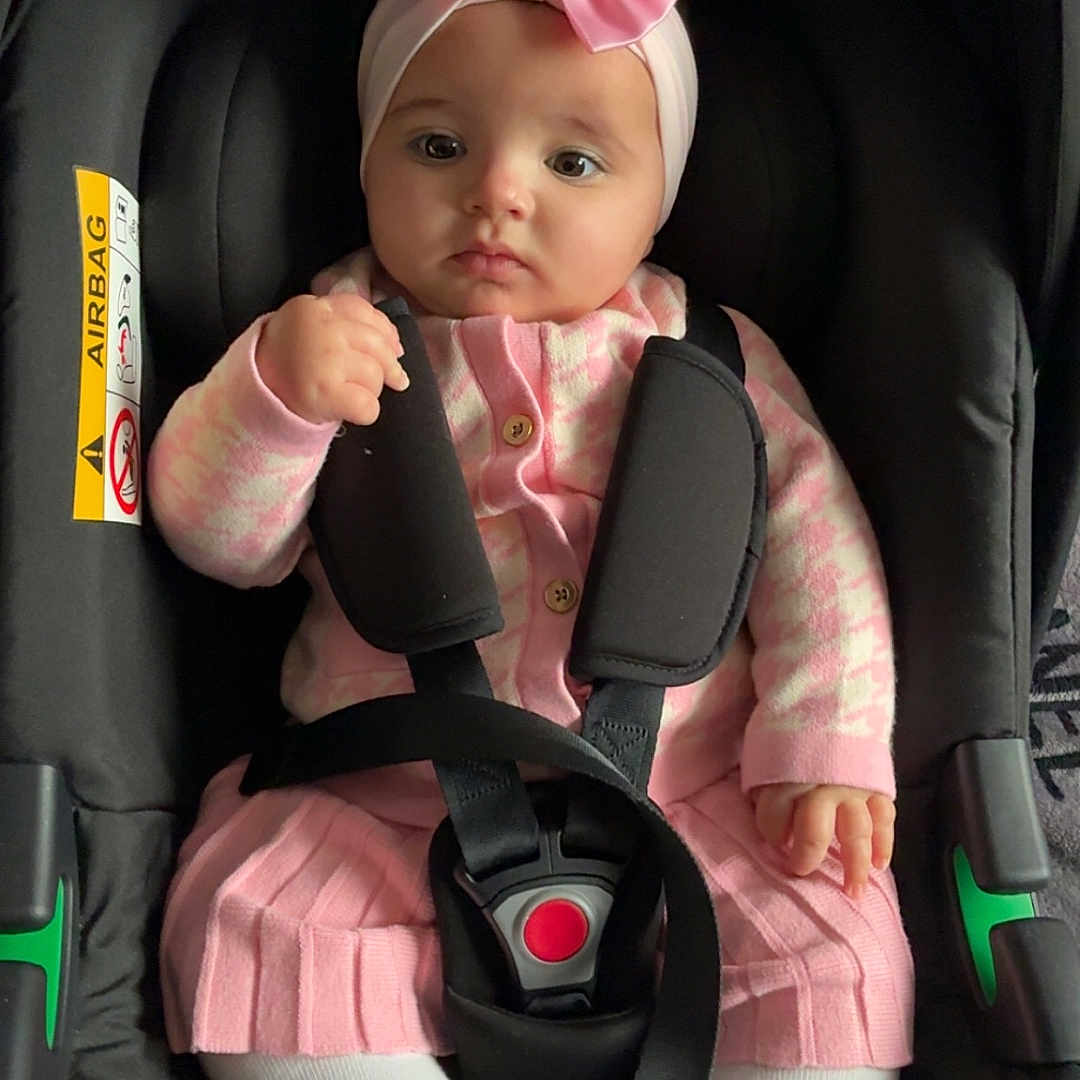 Aaliyah-Mai joined the competition — help win amazing prizes! baby, baby_fashion, baby_girl, car_seat, child, child_seat, closeup, cute, headband, indoor, infant, pink_bow, pink_clothing, portrait, safety_strap, seatbelt, serious_expression, sitting, toddler, white_tights