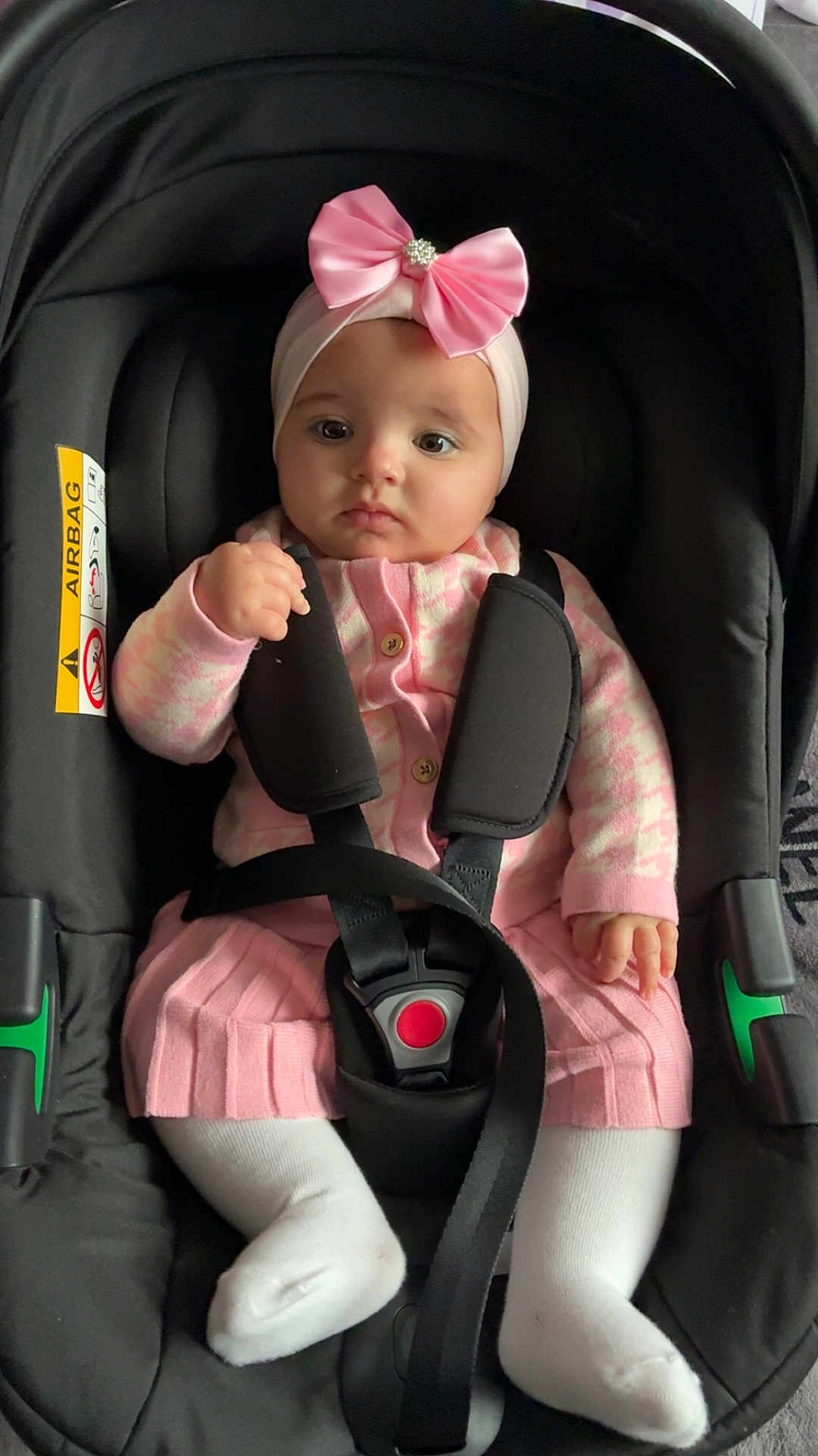 Aaliyah-Mai joined the competition — help win amazing prizes! baby, child, car_seat, pink_bow, headband, pink_clothing, white_tights, safety_strap, infant, cute, indoor, seatbelt, serious_expression, toddler, portrait, baby_girl, sitting, closeup, child_seat, baby_fashion