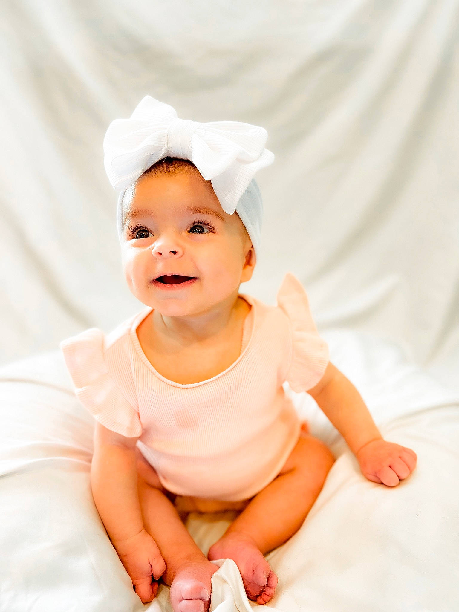 Emelie Giselle joined the competition — help win amazing prizes! baby, baby_toddler_clothing, cheek, child, comfort, eye, finger, flash_photography, fun, gesture, hand, happy, head, headwear, human_body, peach, person, pink, sleeve, smile