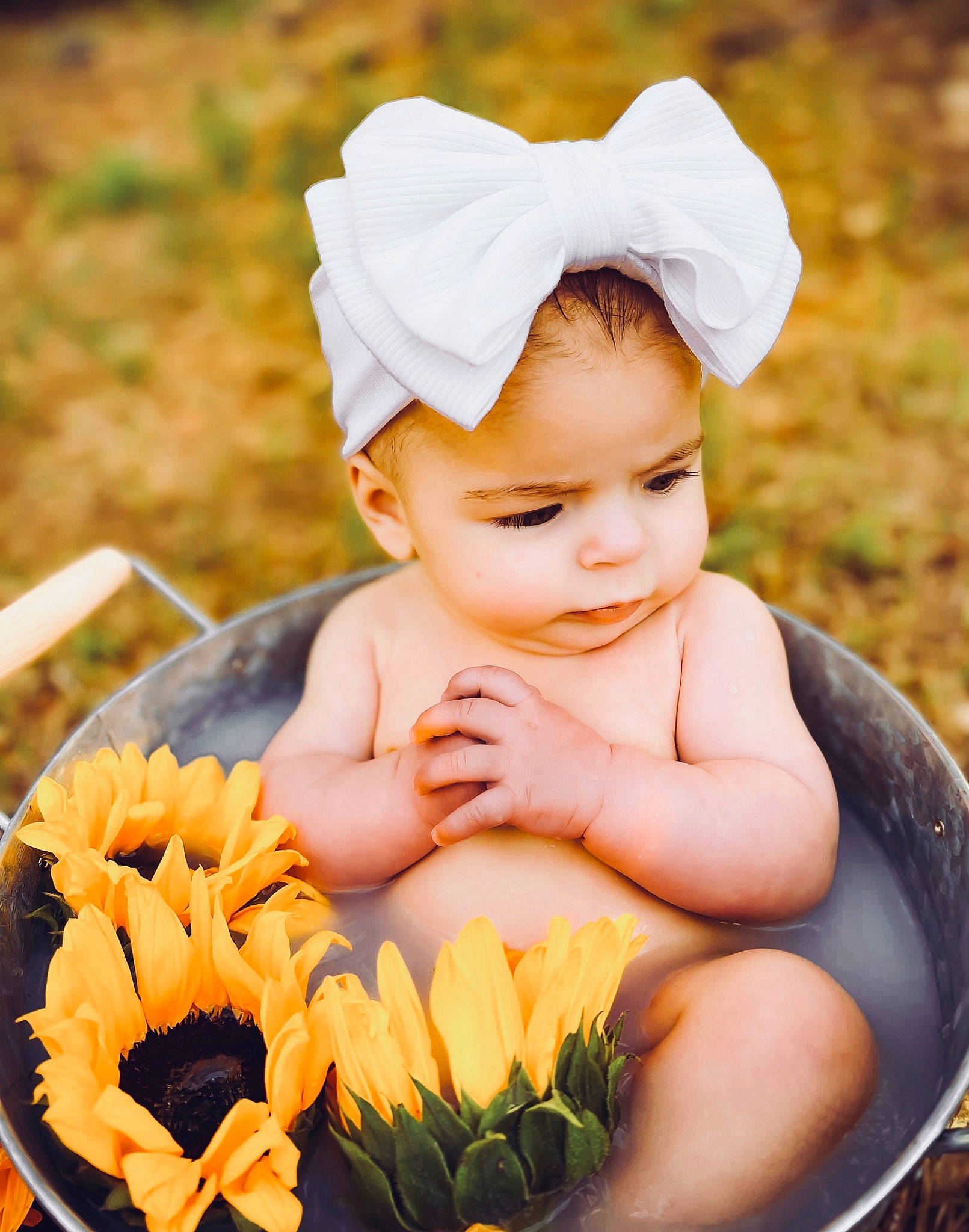 Emelie Giselle is registered to the contest to win money with this photo: baby, baby_toddler_clothing, cap, eye, face, flower, grass, happy, head, headgear, leaf, orange, organ, people_in_nature, person, petal, photograph, plant, skin, smile