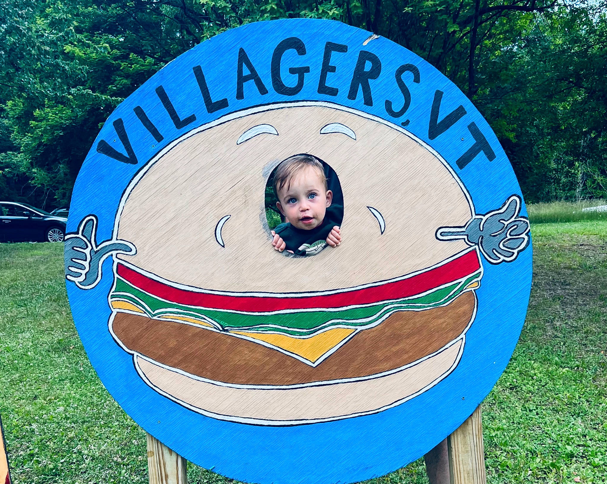 Kylen is registered to the contest to win money with this photo: advertising, art, circle, electric_blue, facial_expression, font, fun, graphics, grass, green, happy, logo, oval, paint, person, picture_frame, plant, sign, signage, symbol